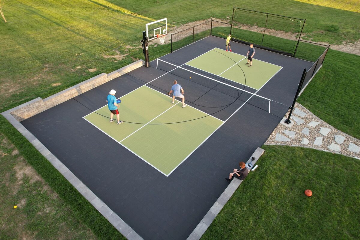 Multi-sport court facility with pickleball and basketball in coastal setting