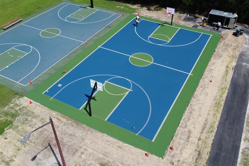 Angled aerial of both finished basketball courts