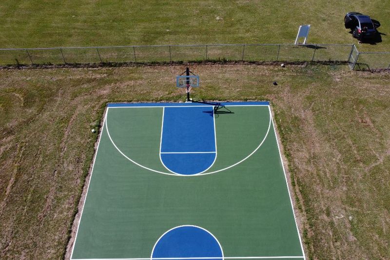Aerial of the key and three-point arc on the finished court
