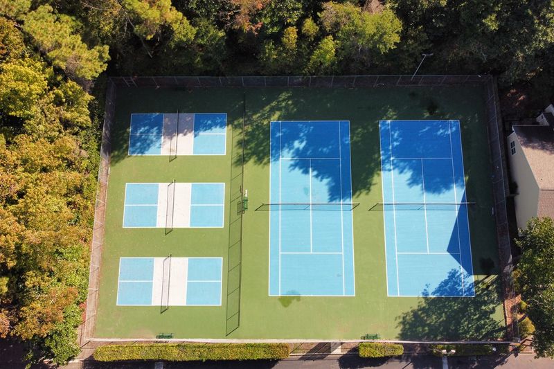 Angled aerial of the pickleball and tennis courts