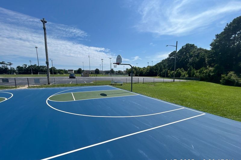 Basketball court three-point arc and goal