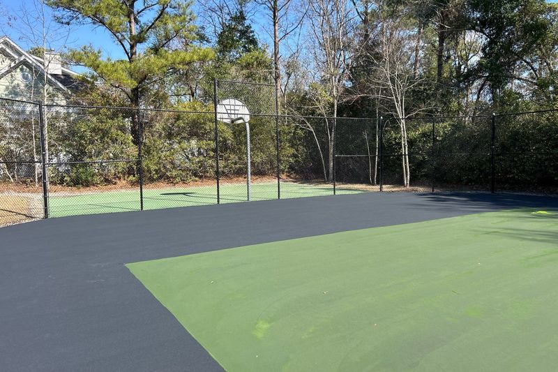Court-level view of the half-coated court and fence