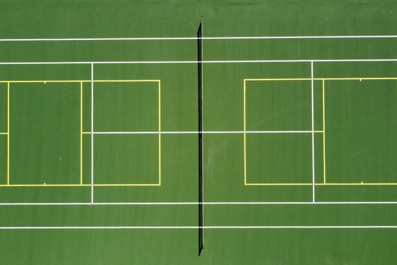 Overhead detail of blended tennis and pickleball lines on the resurfaced court