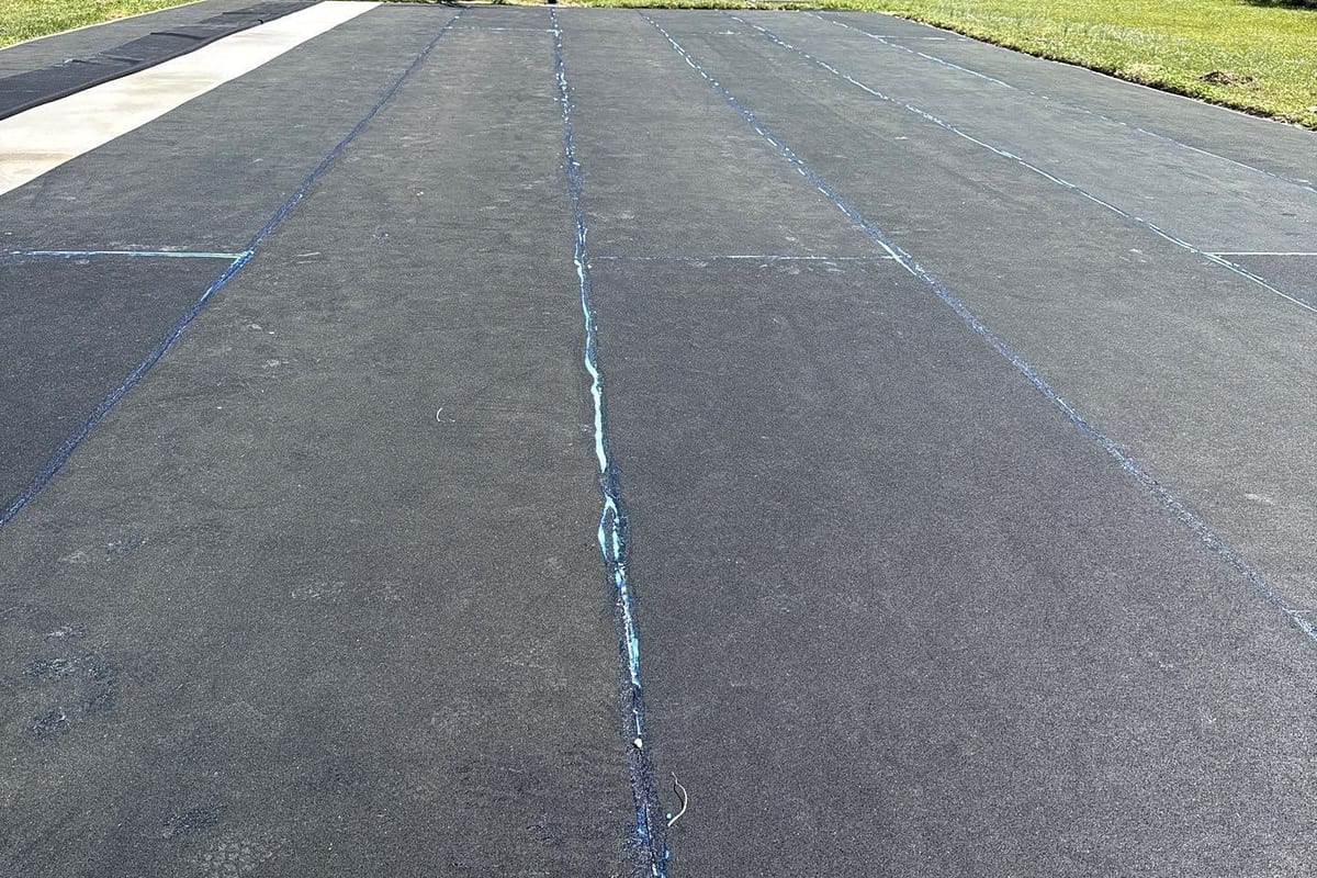 New asphalt basketball court with cracks filled and sealed, ready for acrylic resurfacer — East Arcadia, NC